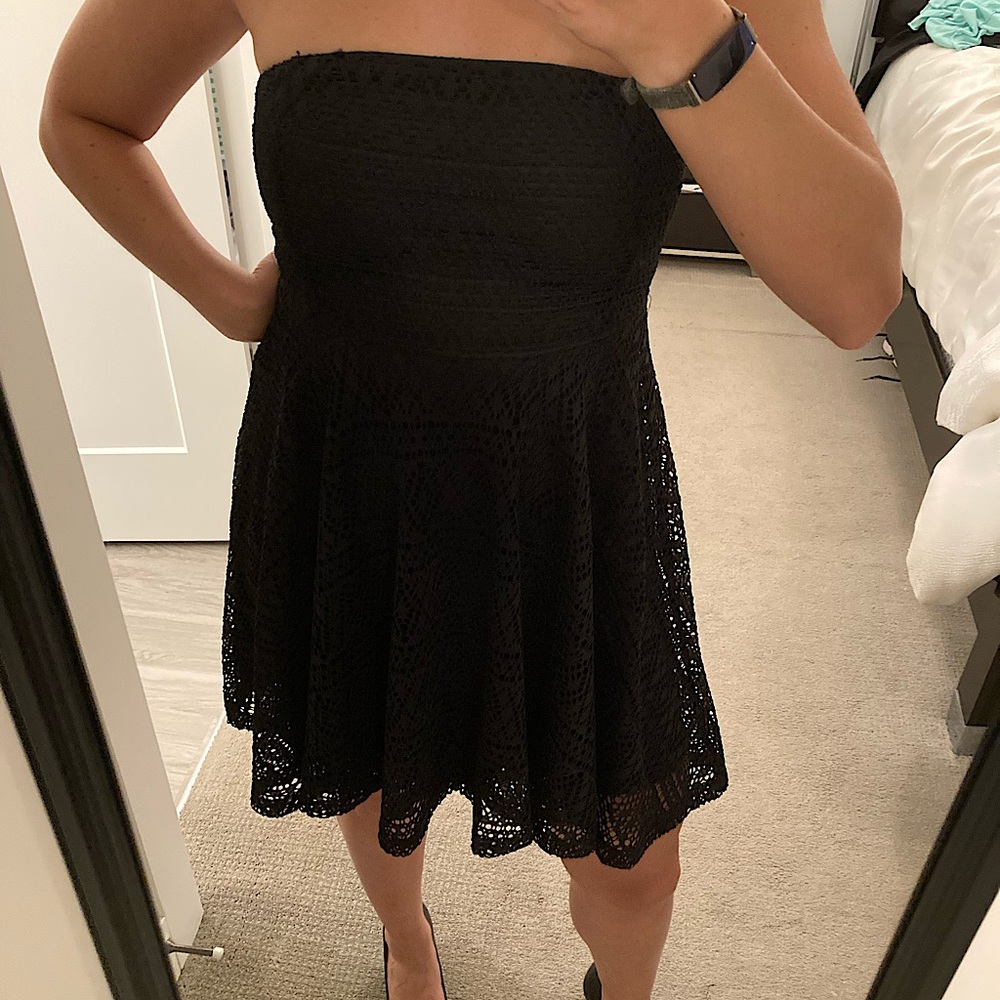 Strapless black eyelet knee-length cocktail dress